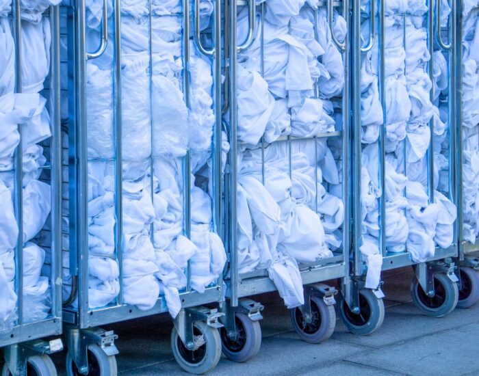 White linens in trolleys for circular solutions